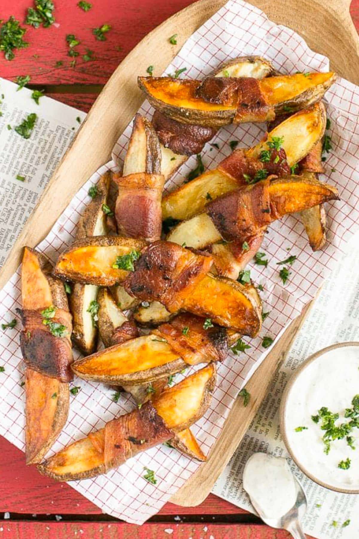 Bacon Wrapped Potato Wedges Recipe | Best Potato Wedges | Bacon Wrapped French Fries | Bacon Potato Wedges #bacon #potato #fries #dinner #sadud Potato wedges on a sheet of parchment paper that have been roasted.