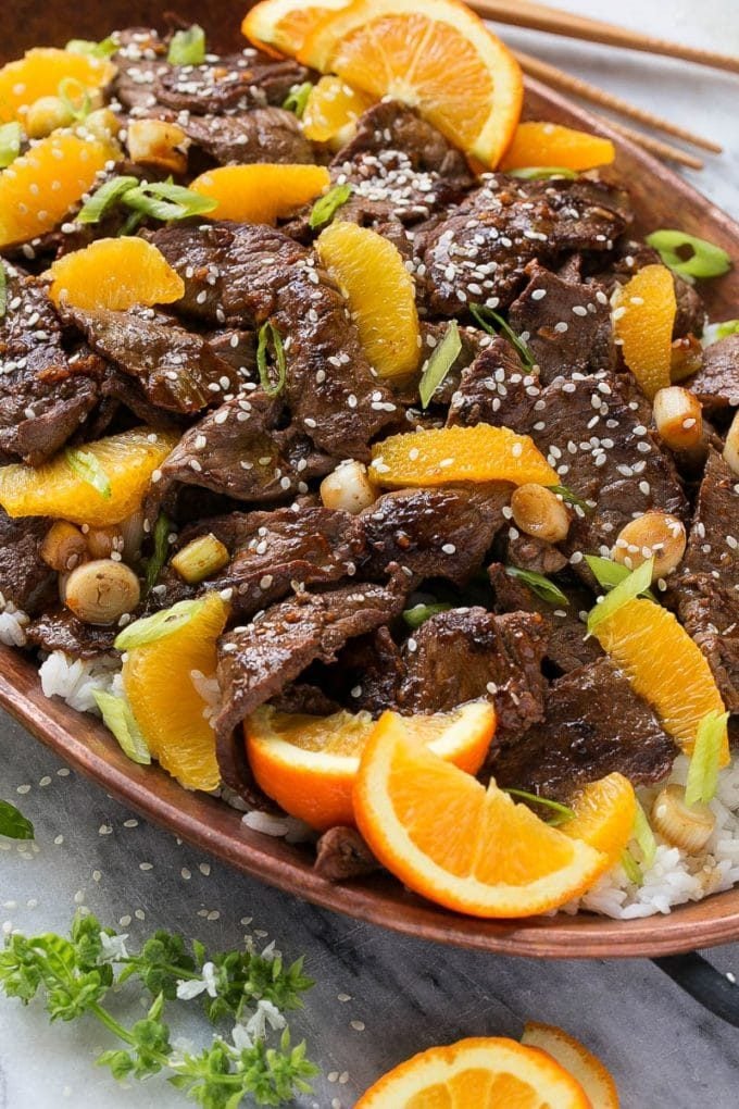 Orange Beef Stir Fry Recipe | 4 Ingredient Orange Beef | Easy Orange Beef #orange #beef #stirfry #asian #dinner #sadud Orange beef topped with green onions and sesame seeds.