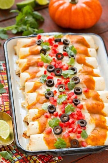 Pumpkin isn't just for dessert! These chicken enchiladas are made with a velvety pumpkin sauce that's totally savory and an unexpected way to elevate enchiladas into a dish fit for company. #ChooseSmart Ad
