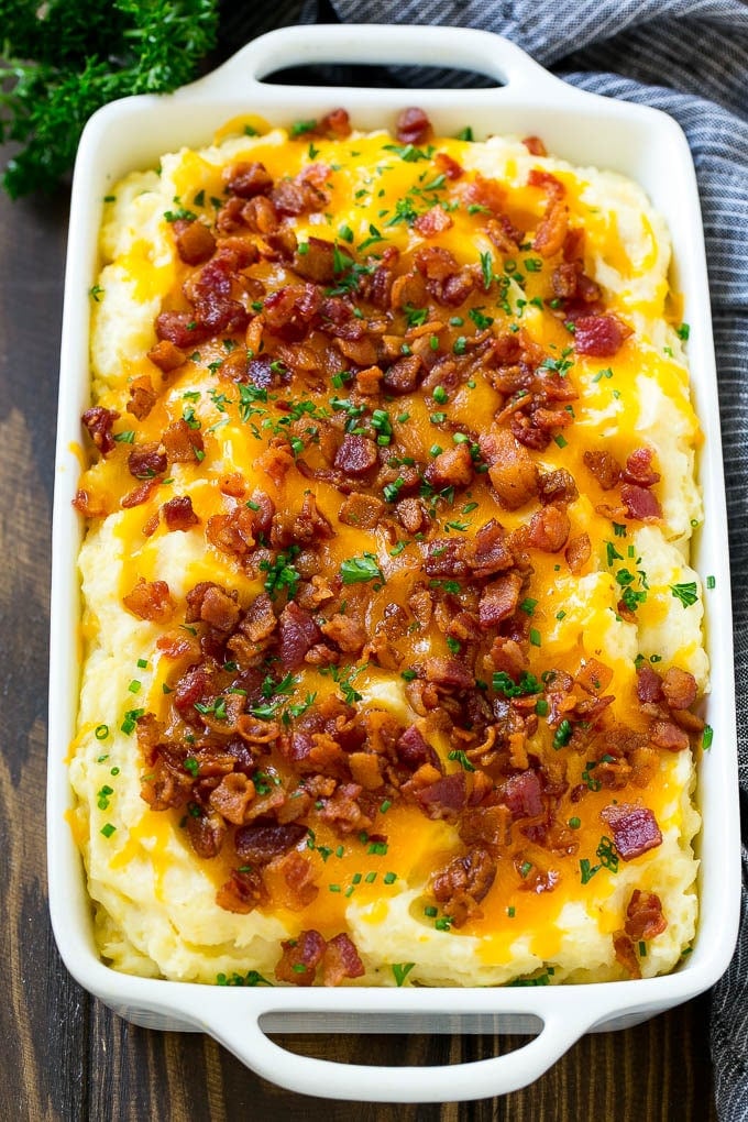 Loaded Mashed Potato Casserole Recipe | Loaded Potatoes | Bacon Mashed Potatoes | Thanksgiving Mashed Potatoes #potatoes #bacon #cheese #casserole #Thanksgiving #dinner #sadud Loaded mashed potato casserole topped with melted cheese, bacon and herbs.