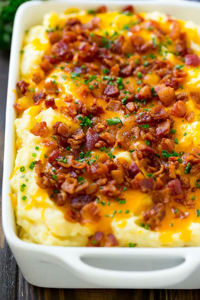 Loaded Mashed Potato Casserole Recipe | Loaded Potatoes | Bacon Mashed Potatoes | Thanksgiving Mashed Potatoes #potatoes #bacon #cheese #casserole #Thanksgiving #dinner #sadud A casserole of loaded mashed potatoes topped with cheddar cheese, crispy bacon and chives.