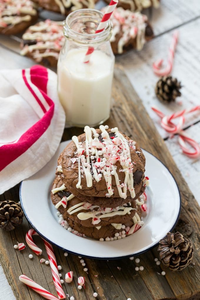 Peppermint Bark Cookie | Easy Peppermint Bark Cookies | Christmas Cookies | Peppermint Bark Cookies | Chocolate Peppermint Cookie #peppermint #peppermintbark #cookies #christmas #holiday #dessert #sadud A plate of chocolate peppermint bark cookies with a bottle of milk on the side.
