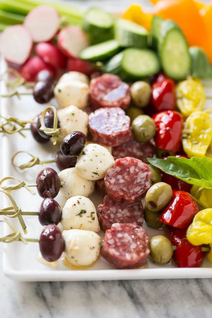 Antipasto Skewers Recipe | Easy Antipasto | Best Antipasto #antipasto #skewers #appetizer #sadud Antipasto skewers on a white serving platter.