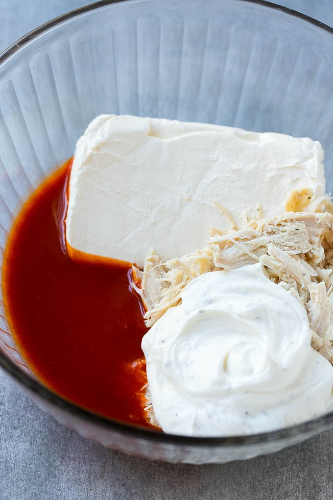 Buffalo Ranch Chicken Dip | Buffalo Chicken Dip | Baked Buffalo Dip | Cheesy Buffalo Dip #buffalowings #buffalochicken #dip #lowcarb #appetizer #sadud Ingredients for the dip in a bowl.