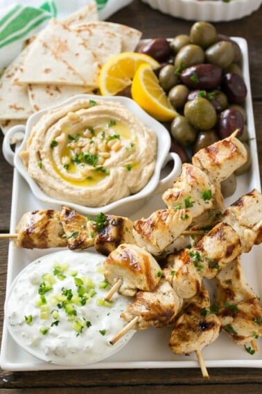 This recipe for greek chicken souvlaki is skewers of tender chicken breast marinated in lemon, garlic and herbs, then grilled to perfection and served with a creamy yogurt sauce. FosterFarmsOrganic AD