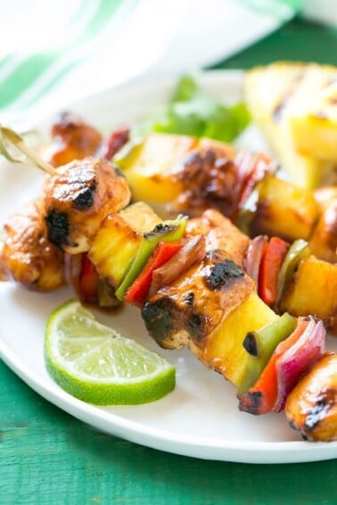 This recipe for Hawaiian Chicken Kabobs is juicy chicken breast, pineapple and vegetables in a sweet and tangy sauce, threaded onto skewers and grilled to perfection. Serve with coconut rice for a taste of the tropics at home!