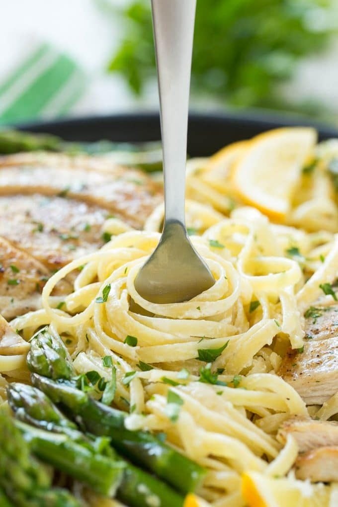 Lemon Asparagus Pasta with Grilled Chicken Recipe | Asparagus Pasta | Grilled Chicken Pasta | Easy Pasta Recipe #pasta #asparagus #lemon #chicken #dinner #sadud A fork serving up a portion of creamy pasta.