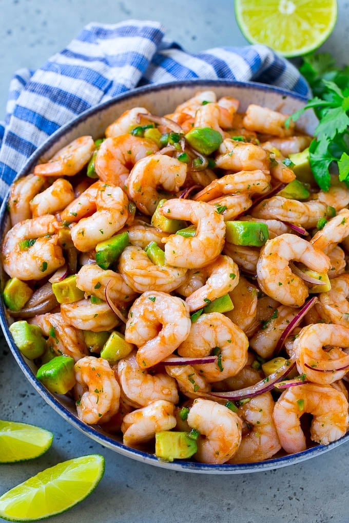 Mexican Shrimp Cocktail Recipe | Coctel de Camarones | Shrimp Cocktail | Mexican Shrimp #shrimp #appetizer #avocado #mexican #sadud A bowl of Mexican shrimp cocktail with red onion, avocado, homemade sauce and cilantro.