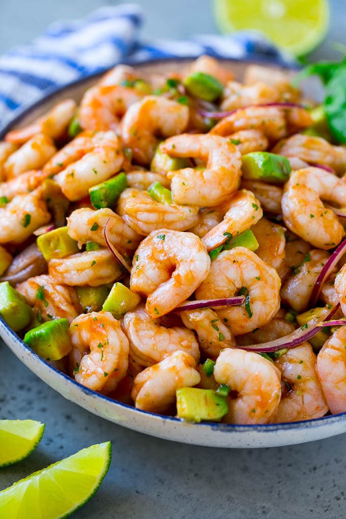 Mexican Shrimp Cocktail Recipe | Coctel de Camarones | Shrimp Cocktail | Mexican Shrimp #shrimp #appetizer #avocado #mexican #sadud A serving bowl of Mexican shrimp cocktail which contains small shrimp, diced avocado, herbs and jalapeno.