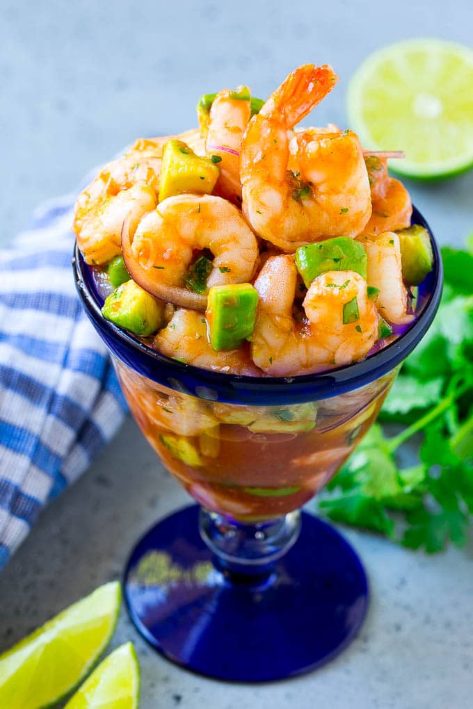Mexican Shrimp Cocktail Recipe | Coctel de Camarones | Shrimp Cocktail | Mexican Shrimp #shrimp #appetizer #avocado #mexican #sadud An individual cup of Mexican shrimp cocktail with red onion and avocado.