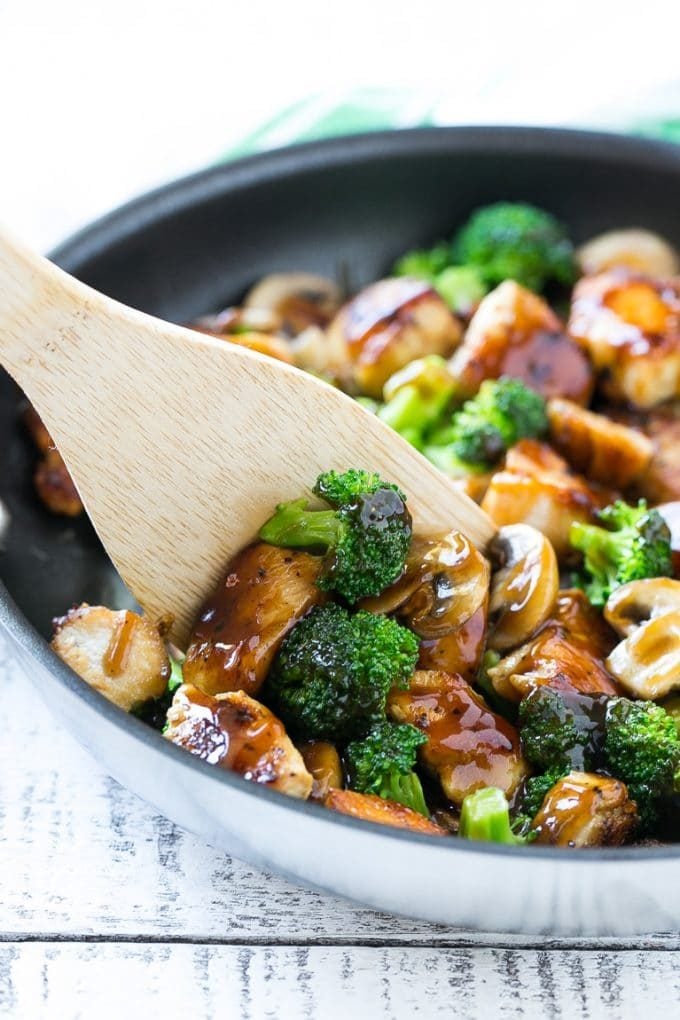 Chicken and Broccoli Stir Fry Recipe | Chicken Stir Fry | Healthy Chicken Recipe | Chicken and Broccoli | Chinese Food #chicken #broccoli #stirfry #healthy #cleaneating #dinner #sadud A spatula scooping chicken stir fry out of a pan.