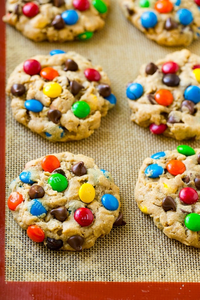 Monster Cookies Recipe | Oatmeal Cookies | Peanut Butter Cookies | M&M's Cookies #baking #cookies #dessert #peanutbutter #chocolate #sadud Baked monster cookies on a sheet pan.