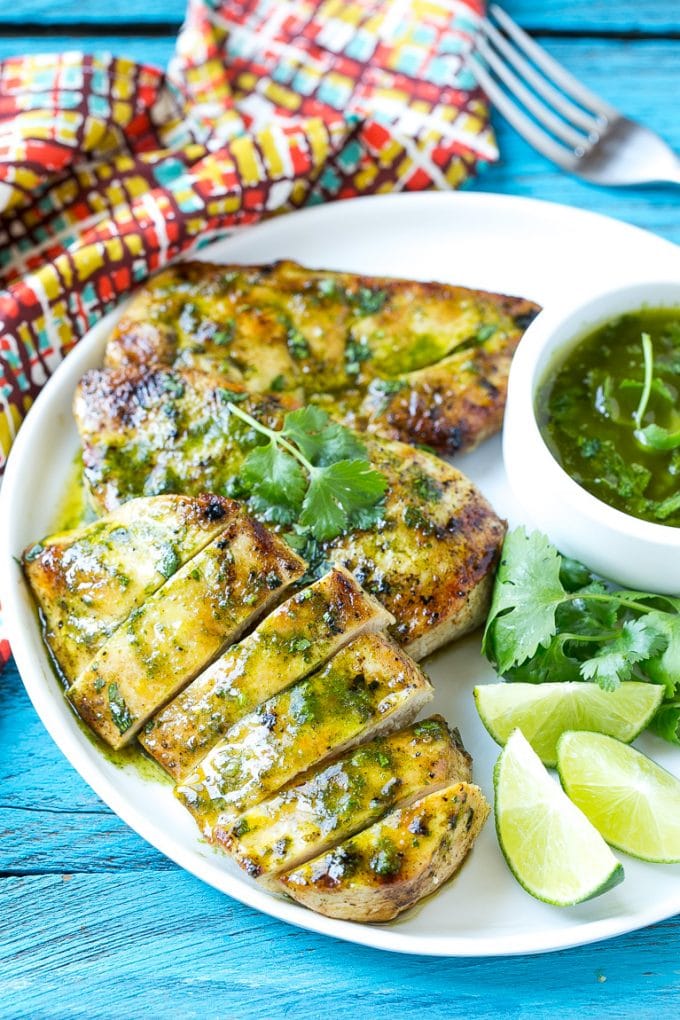 Cilantro Lime Chicken | Grilled Chicken #chicken #grilling #cilantro #lime #dinner #sadud Sliced cilantro lime chicken on a serving plate.