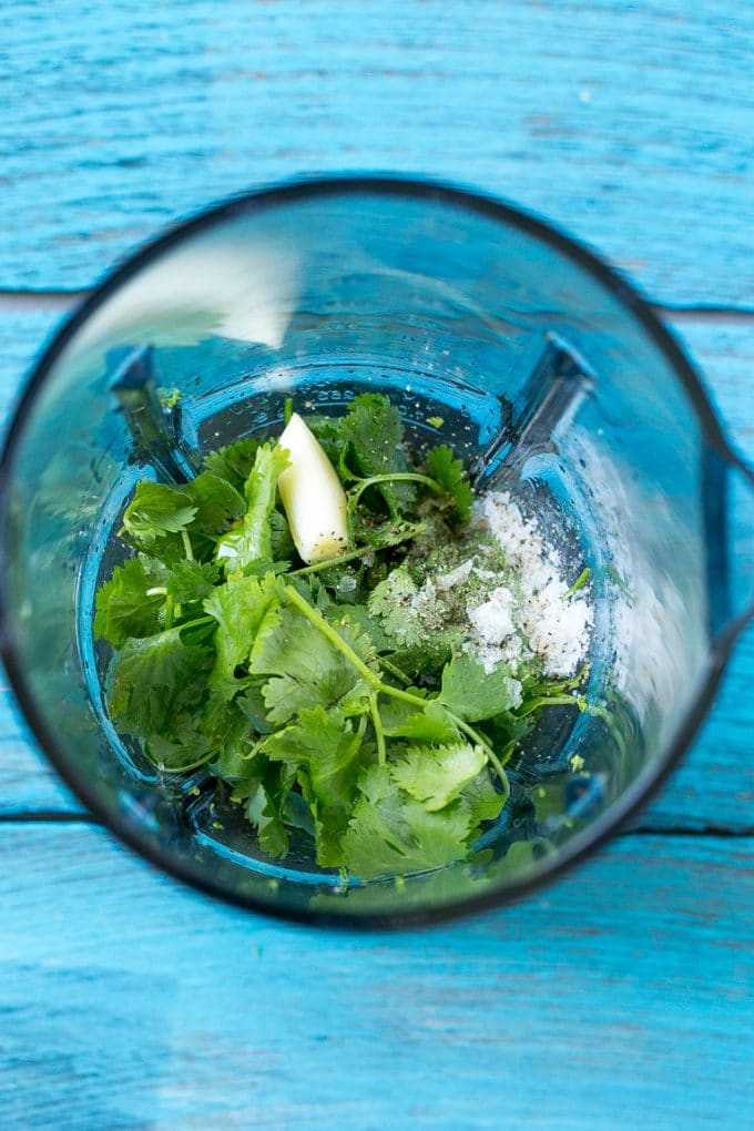 Cilantro Lime Chicken | Grilled Chicken #chicken #grilling #cilantro #lime #dinner #sadud A blender full of cilantro leaves, garlic, lime juice and olive oil.