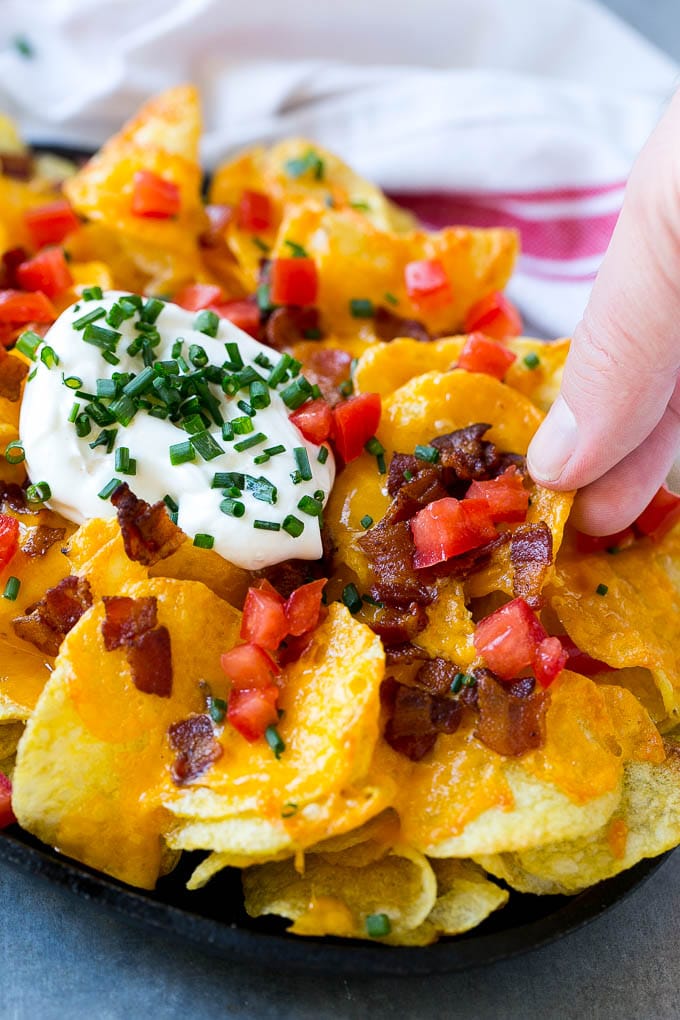 Irish Nachos Recipe | Potato Nachos | Potato Chip Recipe | Appetizer Recipe #nachos #potatoes #cheese #bacon #appetizer #sadud Irish nachos loaded with cheese, bacon, sour cream, tomatoes and chives.