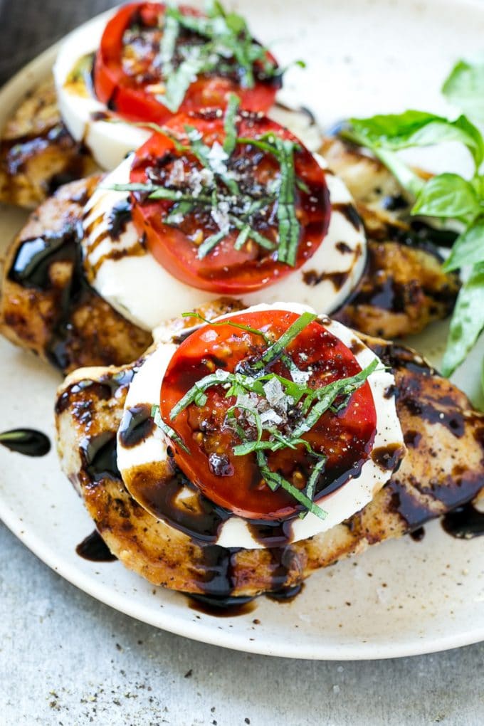 Chicken Caprese Recipe | Grilled Chicken #chicken #caprese #grilling #dinner #tomato #basil #sadud Chicken caprese with sliced tomatoes, balsamic glaze, fresh mozzarella and shredded basil.
