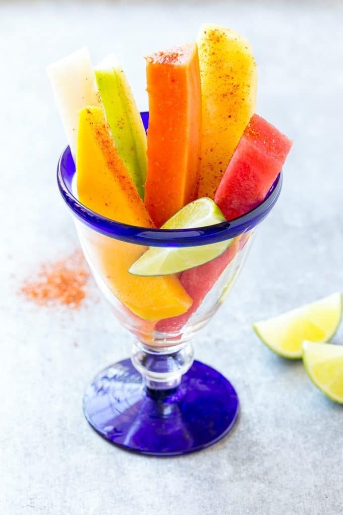 Mexican Fruit Cups | Fruit Cups | Mexican Fruit | Tropical Fruit #fruit #fruitcup #watermelon #pineapple #snack #healthy #sadud Mexican fruit cups topped with chili lime seasoning.