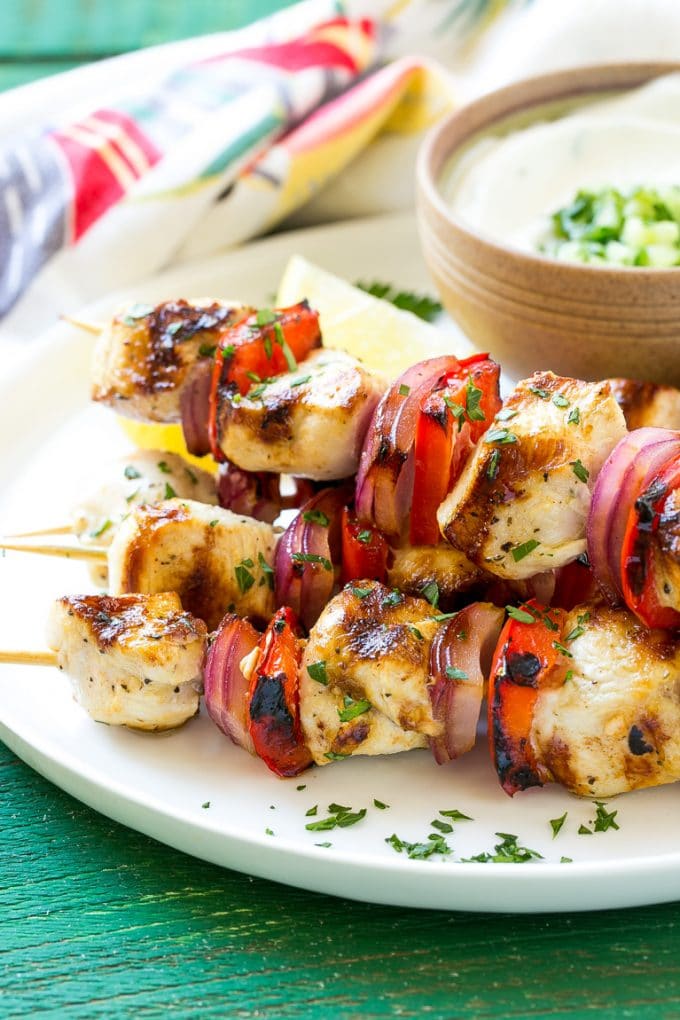 Greek Chicken Kabobs | Grilled Chicken Kabobs | Healthy Chicken Recipe | Greek Chicken #greekfood #chicken #grilling #grilledchicken #kabobs #dinner #sadud A stack of Greek chicken skewers made with peppers and onions.