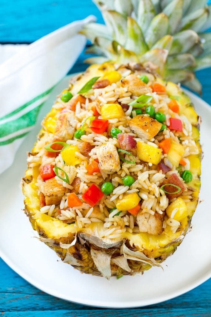 This recipe for pineapple fried rice is loaded with chicken, bacon, crunchy veggies and juicy pineapple. A simple and easy main course or side dish that's MUCH better than take out!