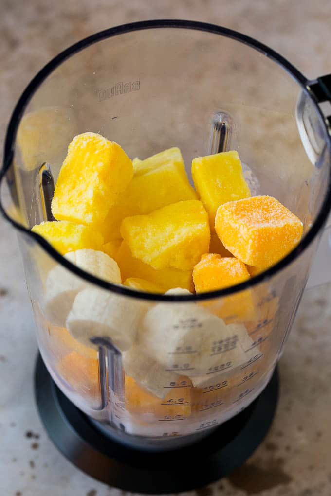 Tropical Smoothie Recipe | Mango Smoothie | Pineapple Smoothie #smoothie #mango #pineapple #banana #drink #sadud Pineapple, mango, banana and coconut milk in a blender.