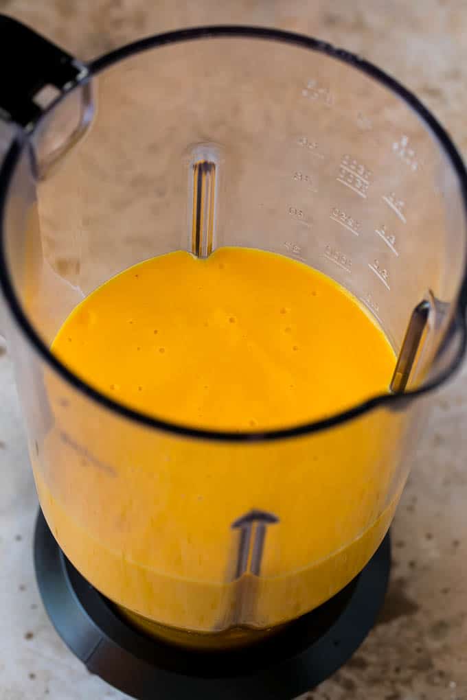 Tropical Smoothie Recipe | Mango Smoothie | Pineapple Smoothie #smoothie #mango #pineapple #banana #drink #sadud A smoothie inside of a blender.