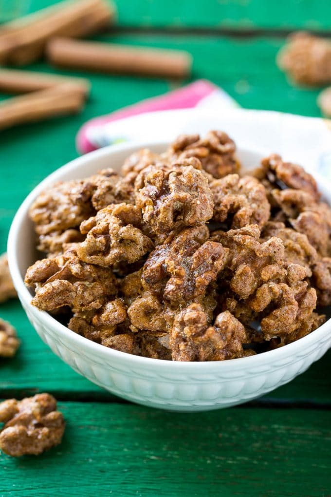Candied Walnuts Recipe | Candied Nuts | Glazed Walnuts | Cinnamon Sugar Walnuts #walnuts #dessert #snack #sadud A white bowl filled with candied walnuts.