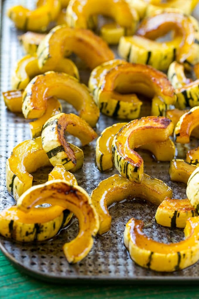 Brown Sugar Delicata Squash Recipe | Roasted Squash | Delicata Squash | Winter Squash Recipe #squash #wintersquash #brownsugar #sidedish #delicatasquash #dinner #sadud A delicata squash recipe with brown sugar roasted squash on a sheet pan.