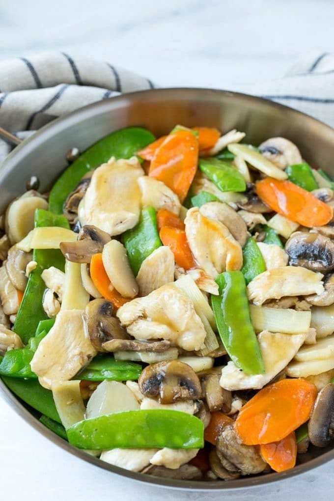 Chicken, vegetable and mushroom stir fry in a pan.