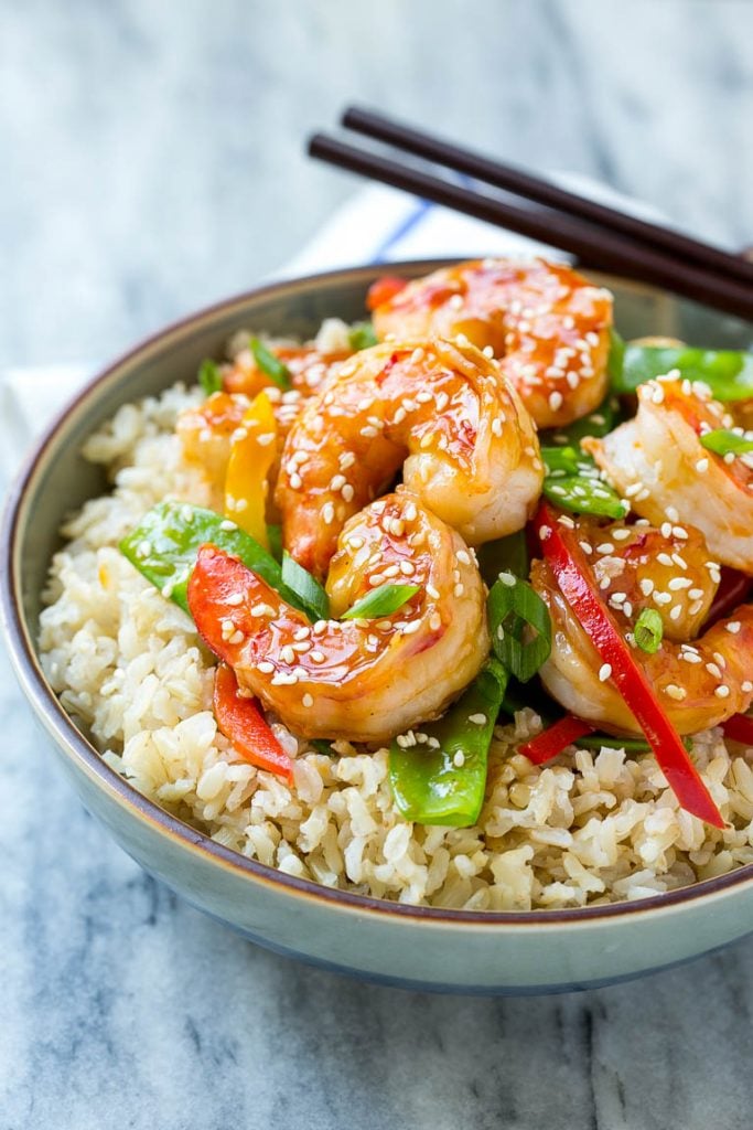 Teriyaki Shrimp Stir Fry Recipe | Shrimp Stir Fry | Healthy Stir Fry #shrimp #teriyaki #vegetables #stirfry #dinner #sadud A bowl of shrimp stir fry and vegetables garnished with sesame seeds.
