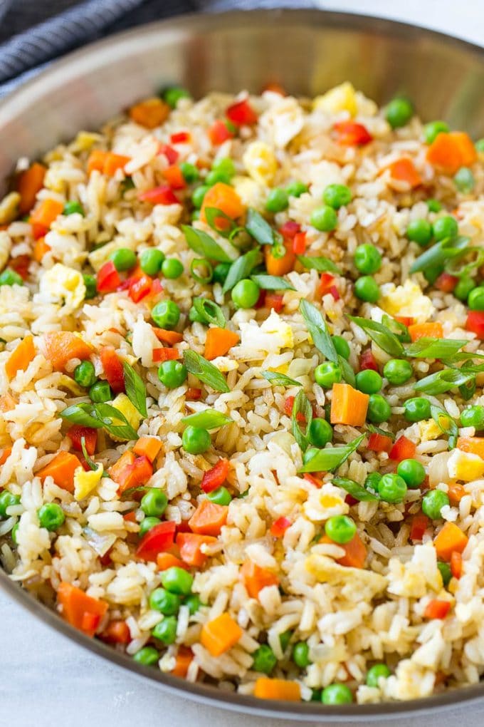Veggie Fried Rice Recipe | Vegetarian Fried Rice | Easy Fried Rice Recipe | Chinese Food #rice #friedrice #veggie #vegetarian #sidedish #sadud A skillet of vegetarian fried rice with eggs, peas, carrots and peppers.