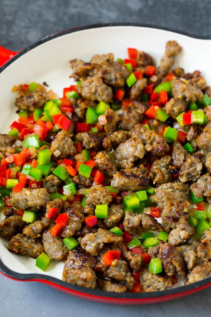 Sweet Potato Hash #sweetpotato #sausage #breakfast #brunch #sadud Sausage, onions and bell peppers in a skillet.