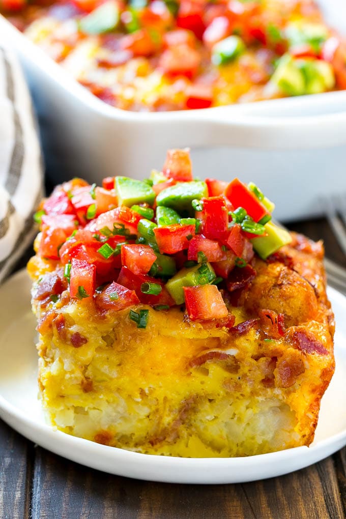 Breakfast Casserole with Bacon Recipe | Bacon and Egg Casserole | Egg Casserole with Bacon | Bacon Breakfast Casserole #eggs #bacon #casserole #breakfast #brunch #sadud A slice of egg casserole with potato tots in it.