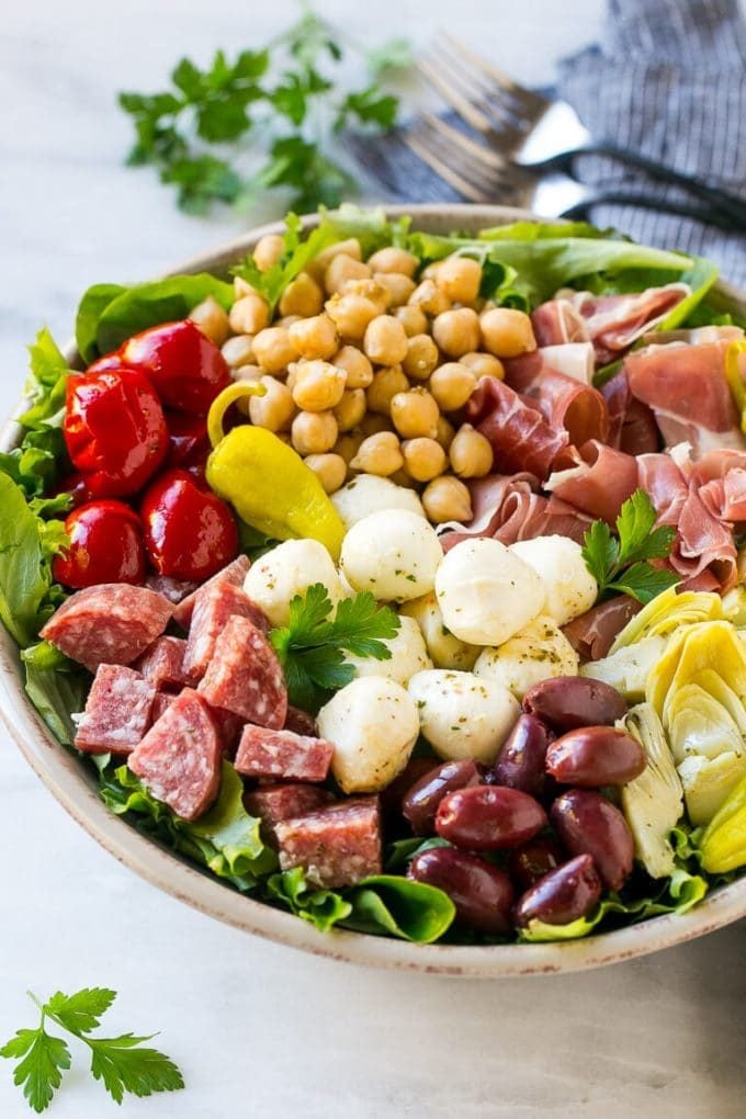 Antipasto Salad Recipe | Italian Salad | Main Course Salad | Antipasto Recipe #salad #salami #italianfood #dinner #lunch #sadud Antipasto salad with cured meats, fresh mozzarella cheese and roasted peppers over salad greens.