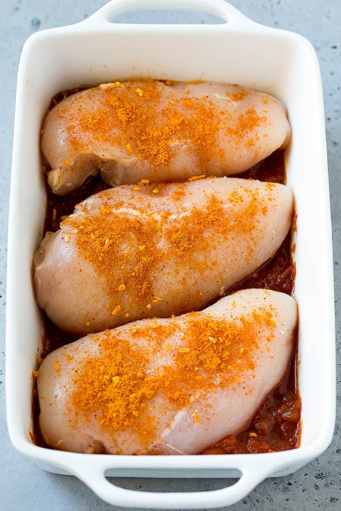 Salsa Chicken Recipe | Baked Chicken | Mexican Chicken #chicken #salsa #mexican #lowcarb #keto #glutenfree #dinner #sadud Poultry in a baking dish topped with taco seasoning.