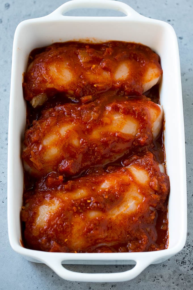 Salsa Chicken Recipe | Baked Chicken | Mexican Chicken #chicken #salsa #mexican #lowcarb #keto #glutenfree #dinner #sadud Chicken breasts in a baking dish coated with salsa.