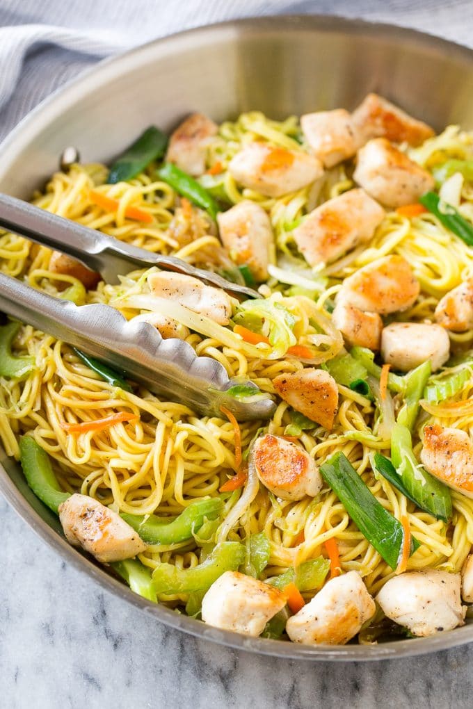 Chicken Chow Mein Recipe | Easy Chicken Recipe | Chow Mein | Chinese Food #chowmein #takeout #asianfood #sadud A pan of chicken chow mein with serving tongs in it.