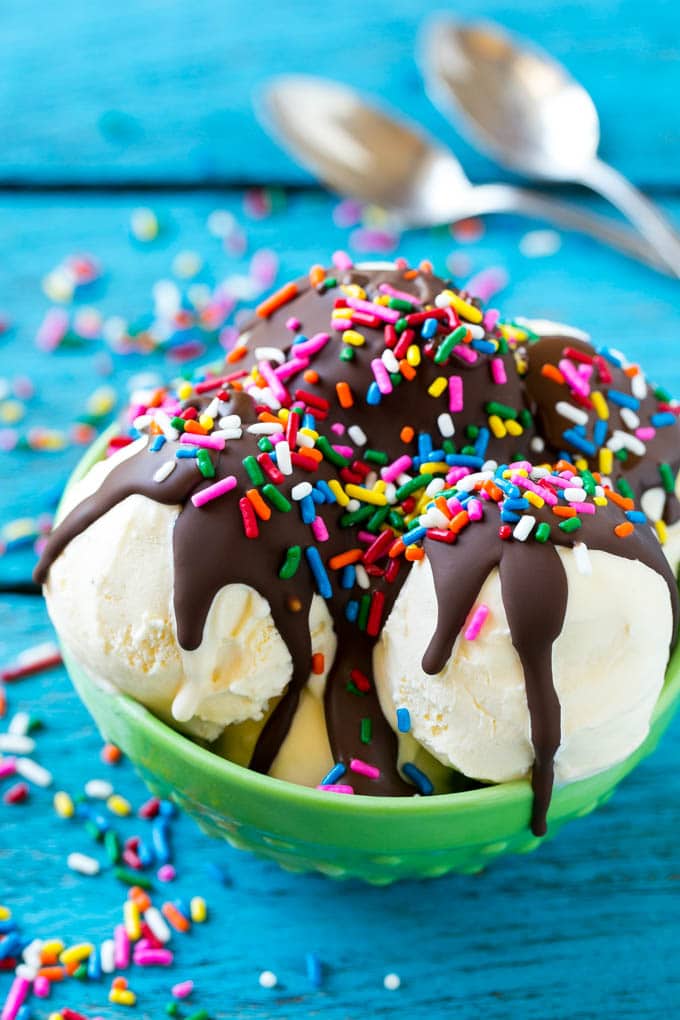 Homemade Magic Shell Recipe | Chocolate Ice Cream Topping | Chocolate Sauce | Hard Chocolate Coating #chocolate #icecream #dessert #sadud Magic shell over scoops of ice cream, topped with rainbow sprinkles.