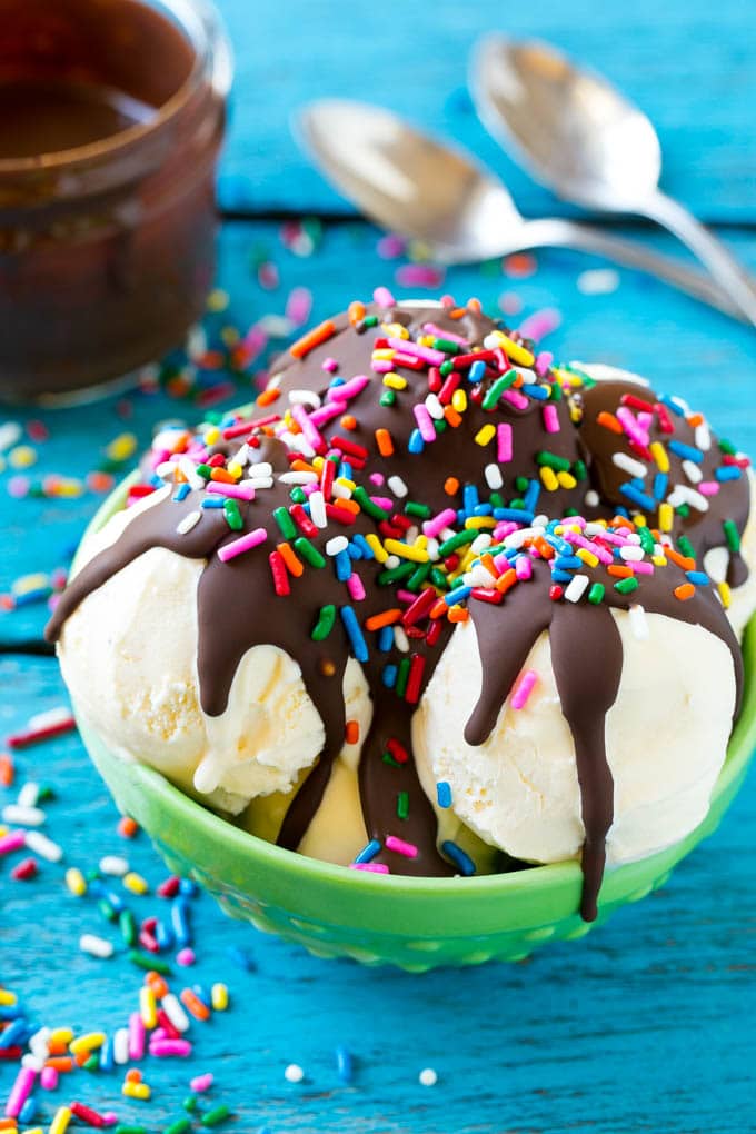 Homemade Magic Shell Recipe | Chocolate Ice Cream Topping | Chocolate Sauce | Hard Chocolate Coating #chocolate #icecream #dessert #sadud Magic shell over vanilla ice cream with rainbow sprinkles.