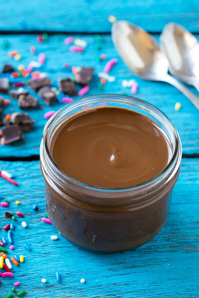 Homemade Magic Shell Recipe | Chocolate Ice Cream Topping | Chocolate Sauce | Hard Chocolate Coating #chocolate #icecream #dessert #sadud A jar of chocolate chocolate shell.