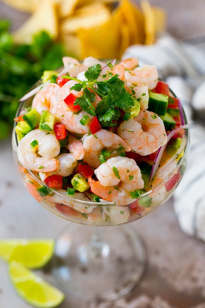 Shrimp Ceviche Recipe | Mexican Shrimp | Marinated Shrimp #shrimp #ceviche #cleaneating #healthy #lowcarb #keto #glutenfree #dinner #appetizer #sadud Shrimp ceviche in a serving cup garnished with cilantro.