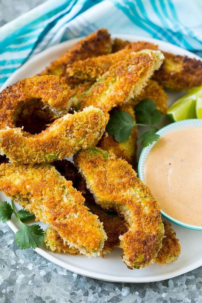 Avocado Fries Recipe | Fried Avocado | Avocado Fritters #avocado #appetizer #snack #sadud A plate of avocado fries served with dipping sauce.