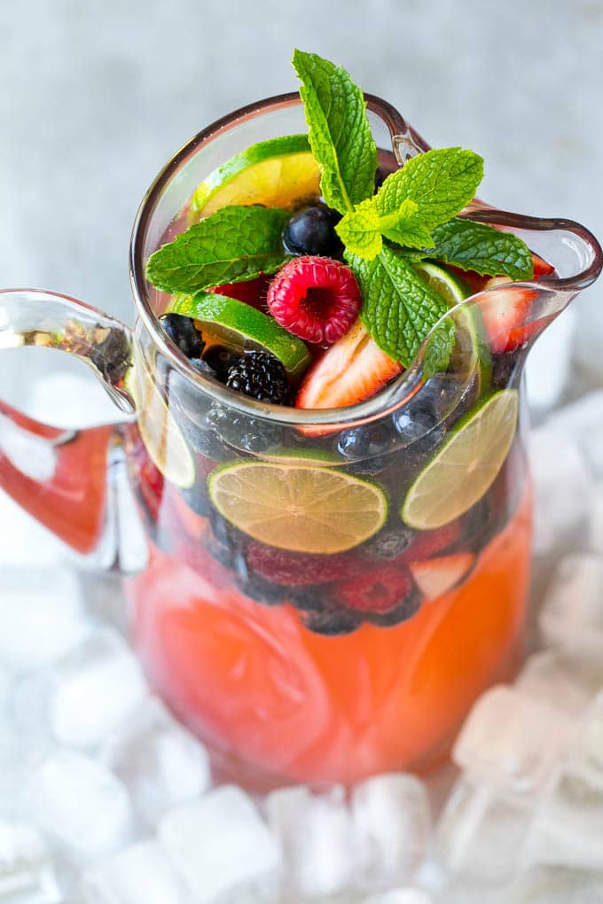 Berry Champagne Punch Recipe | Champagne Cocktail | Lime Cocktail | Berry Punch | Champagne Recipe #champagne #punch #berries #drink #sadud A pitcher of champagne punch filled with fresh berries and mint sprigs.