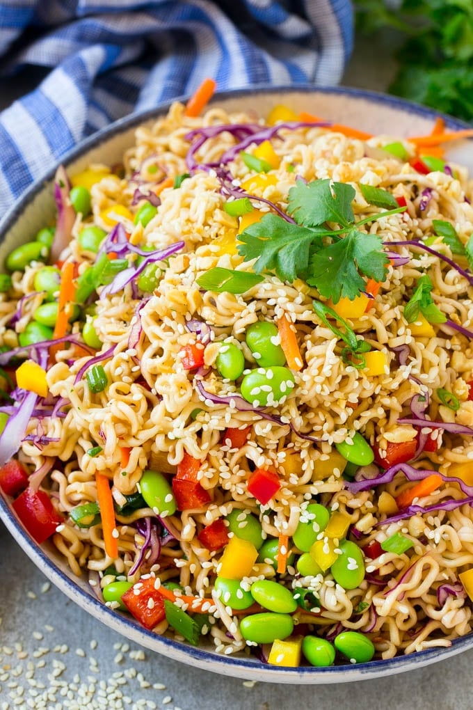 Asian Noodle Salad Recipe | Ramen Noodle Salad | Asian Salad #salad #noodles #edamame #vegetarian #sadud #lunch A bowl of Asian noodle salad with colorful vegetables.
