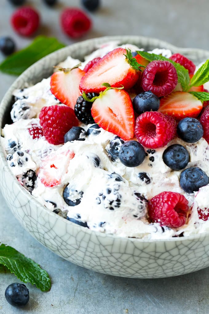 Berry Cheesecake Salad Recipe | Fruit Salad | Berry Fruit Salad | Cheesecake Salad #salad #cheesecake #fruit #berries #sidedish #dessert #sadud A serving bowl of creamy berry salad topped with blueberries, raspberries and strawberries.