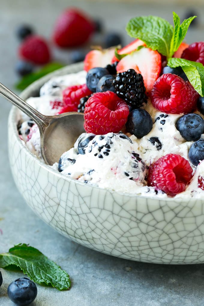 Berry Cheesecake Salad Recipe | Fruit Salad | Berry Fruit Salad | Cheesecake Salad #salad #cheesecake #fruit #berries #sidedish #dessert #sadud Berry cheesecake salad in a bowl garnished with fresh berries and mint.