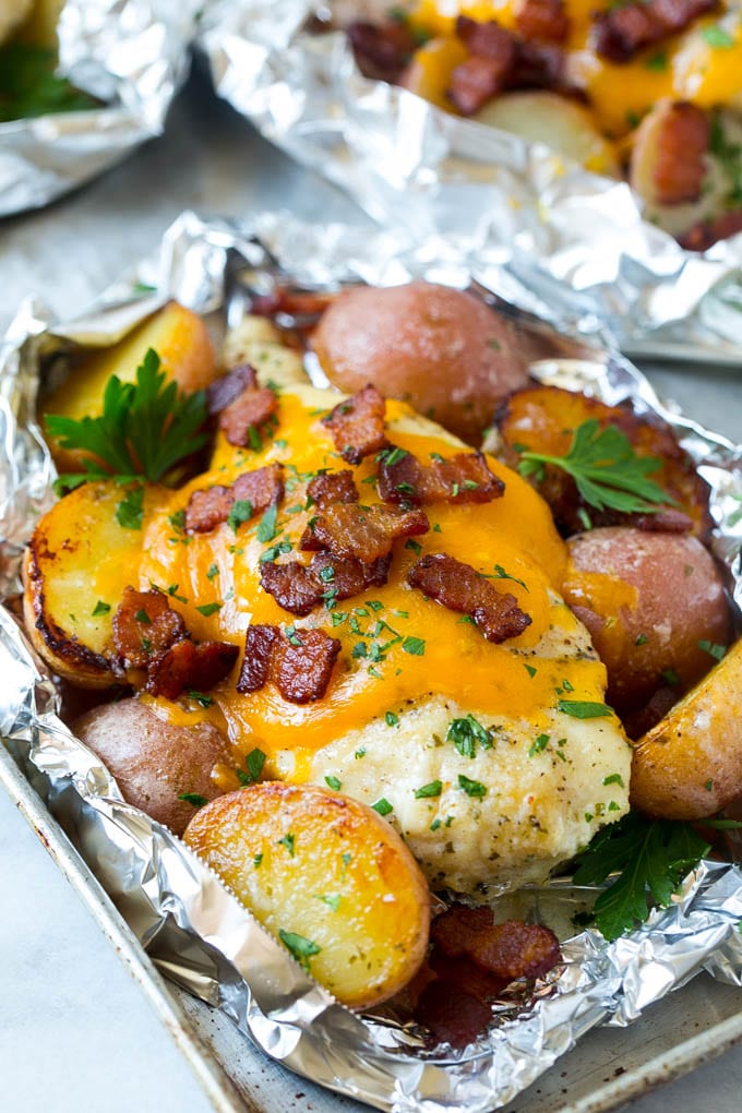 Bacon Ranch Chicken Foil Packets | Chicken in Foil | Foil Packet Recipe | Ranch Chicken #ranchchicken #grilling #chicken #foilpacket #foilpackets #bacon #dinner #sadud Chicken in foil topped with cheddar cheese and bacon.