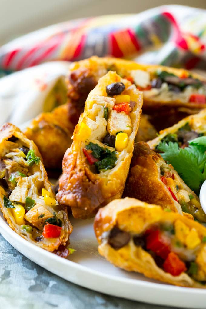Southwestern Egg Rolls Recipe | Easy Egg Roll Recipe | Mexican Appetizer | Egg Roll Recipe | Southwest Egg Rolls #eggrolls #appetizer #chicken #snack #sadud Chicken egg rolls with colorful vegetables, cut and served with avocado ranch sauce.