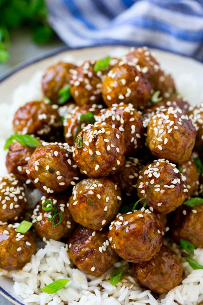Teriyaki Meatballs Recipe | Asian Meatballs Recipe | Easy Meatball Recipe | Appetizer Meatballs #meatballs #teriyaki #beef #rice #dinner #sadud Meatballs topped with homemade sauce and sesame seeds.