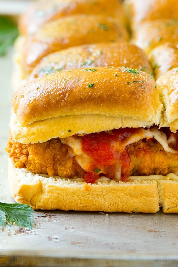 Chicken Parmesan Sliders | Chicken Parmesan Sandwich Recipe | Slider Sandwich Recipe #sliders #chickenparm #chickenparmesan #chickenparmesansliders #dinner #appetizer #sadud Crispy chicken with tomato sauce and cheese on slider buns.