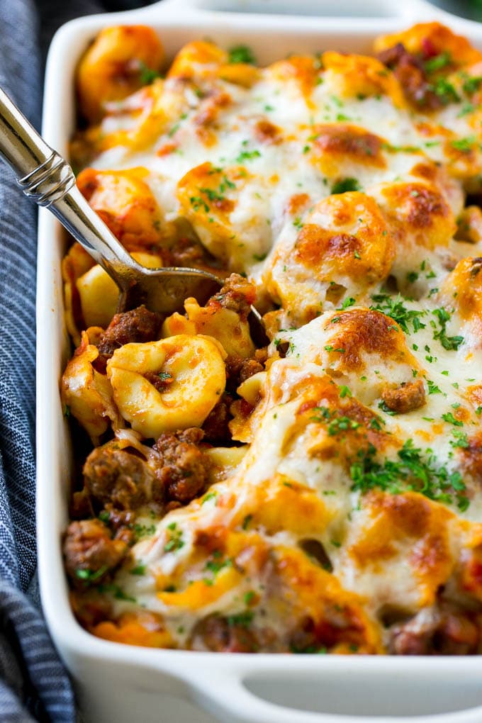 Baked Tortellini with Meat Sauce Recipe | Cheese Tortellini | Tortellini Recipe | Baked Pasta Recipe #tortellini #bakedtortellini #meatsauce #pasta #dinner #sadud A pan of baked tortellini in a meat sauce, all covered with cheese.